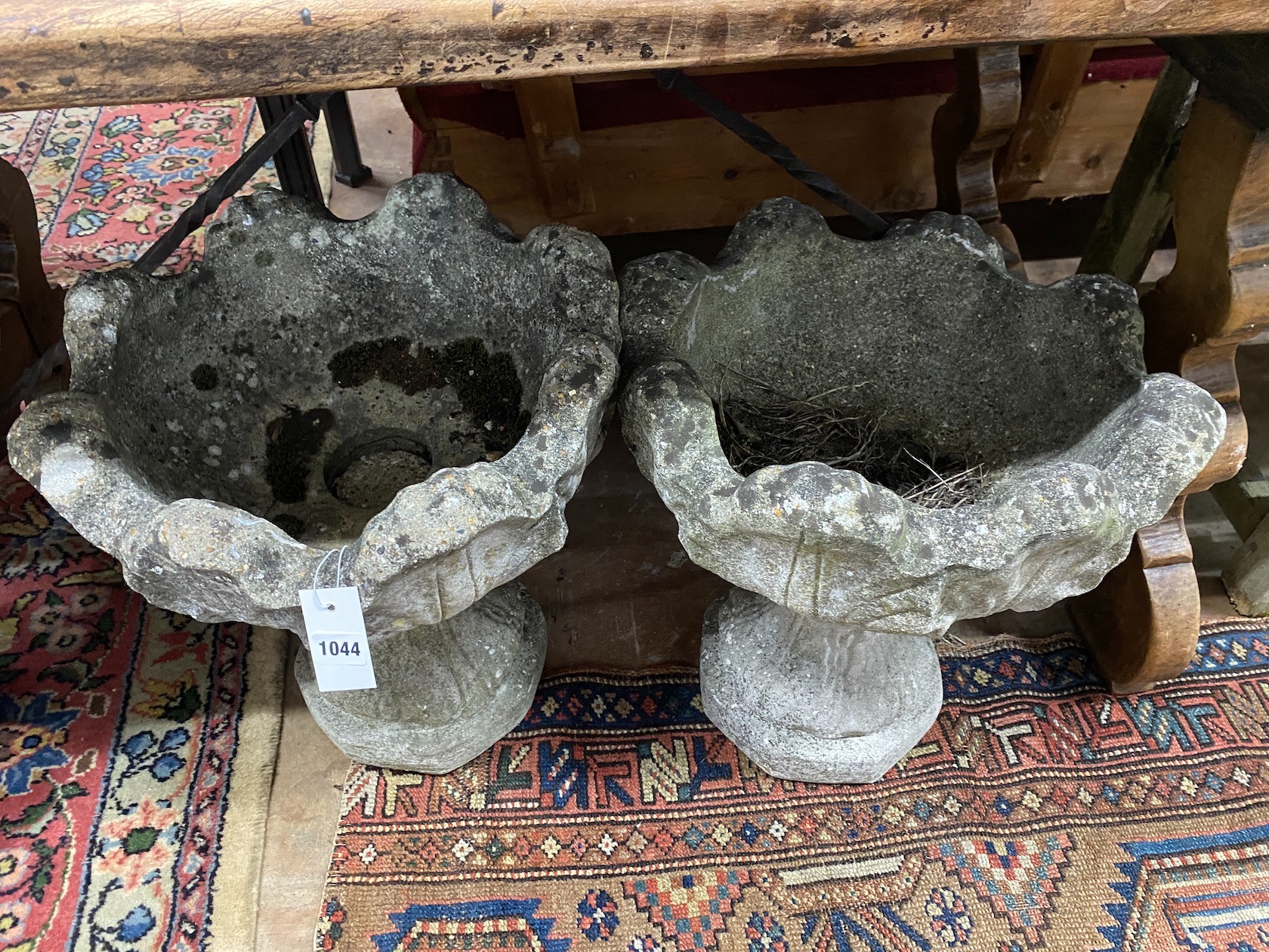 A pair of reconstituted stone garden planters, width 44cm, height 48cm